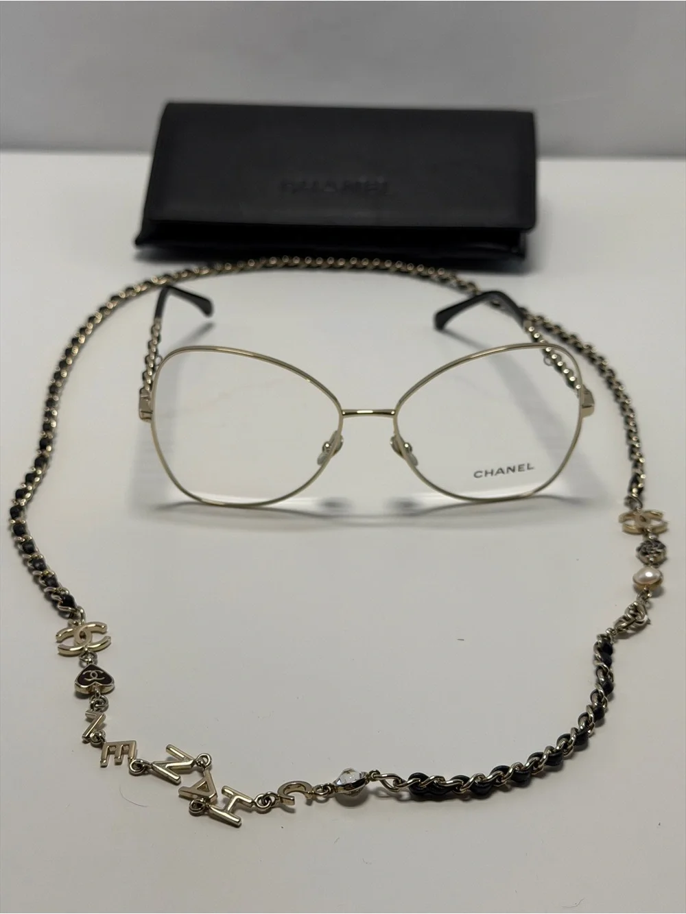 CHANEL  Gold and Black Eye ear Chain with Silver-Tone Glasses